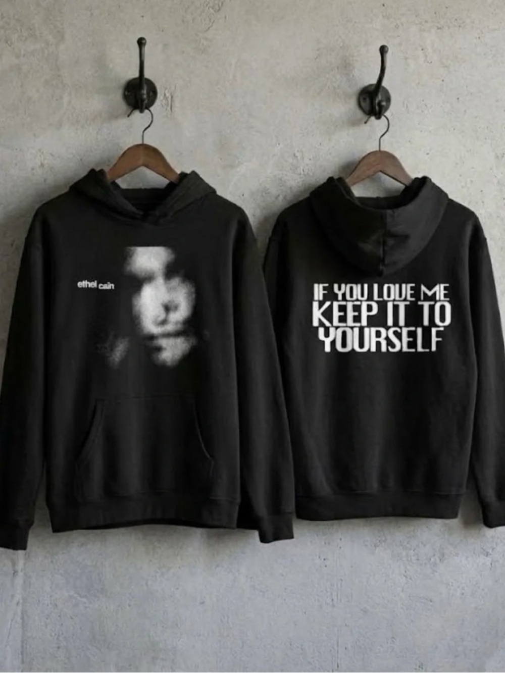 Black Hoodie with White Face Graphic and Bold Back Text